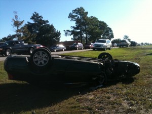 Flipped Chrysler Sebring A Chrysler Sebring flipped on its roof with one wheel missing